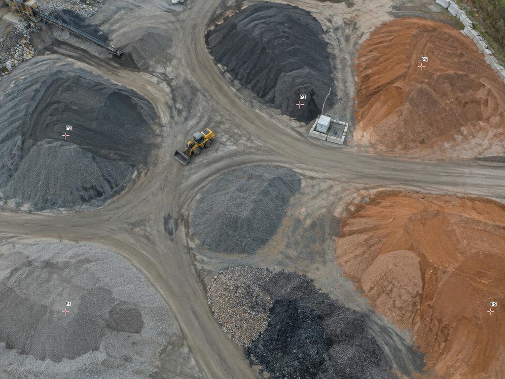 Aerial view of aggregate and soil stockpiles measured for volume